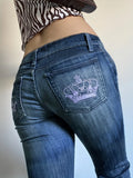 Dermearne Low waisted embroidered micro flared pants with a back pocket